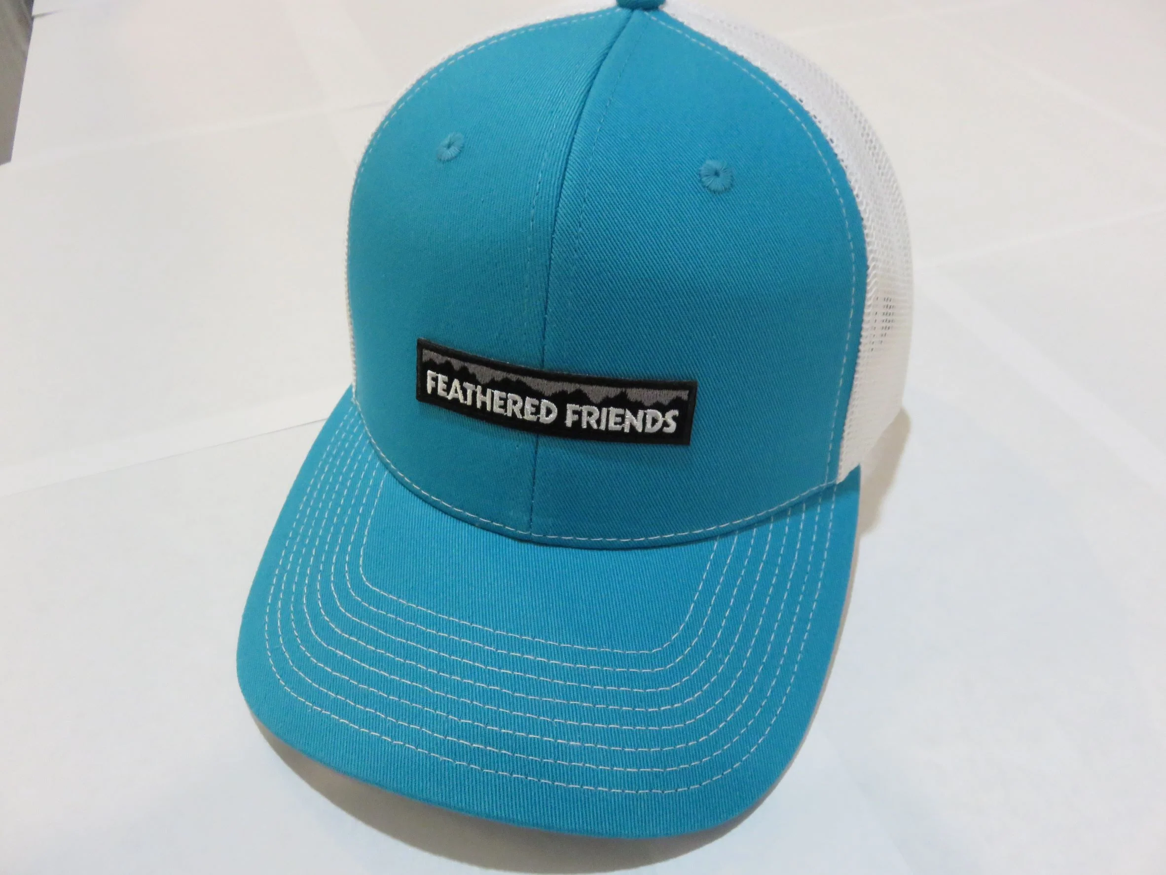 Feathered Friends Pro Style Trucker Mountain Logo Patch Hat - Image 8